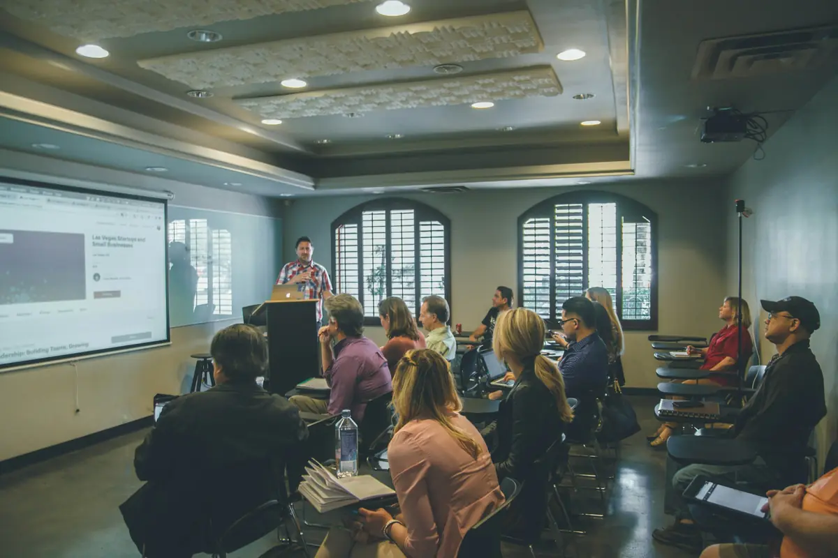 A large seminar room full of students
