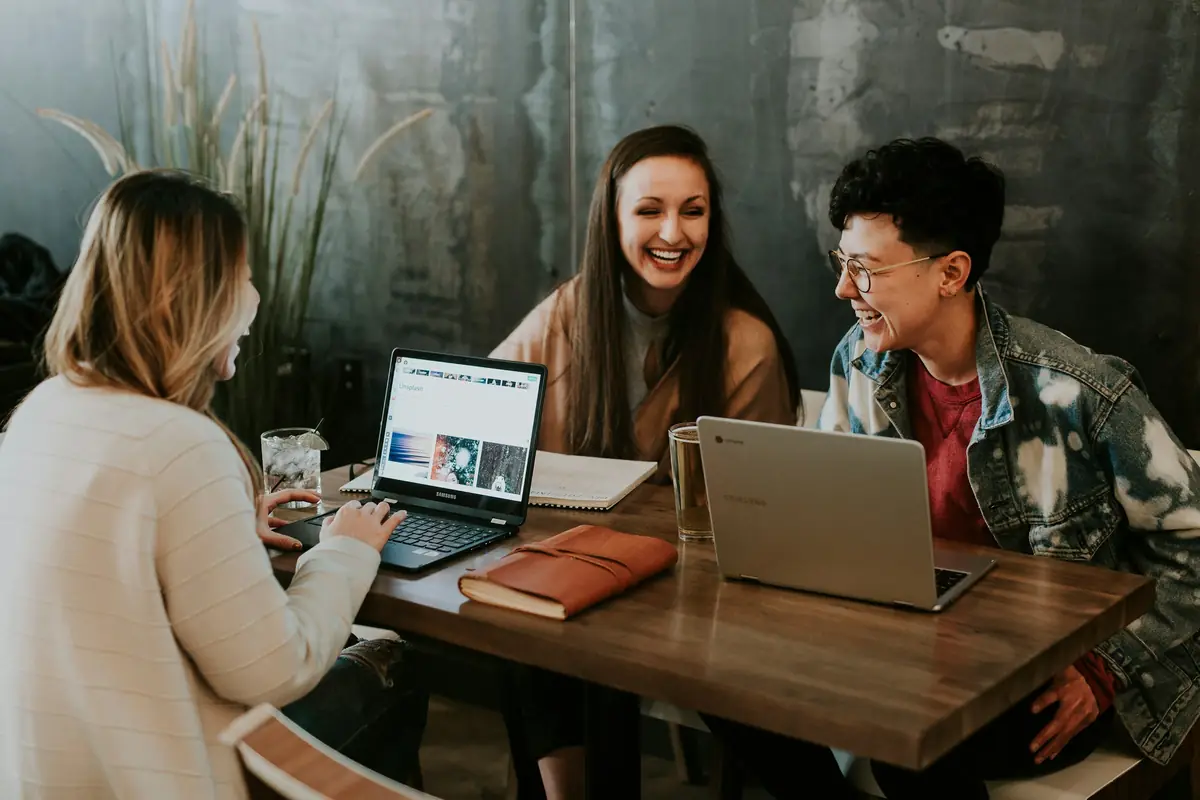 A small team working together around laptops